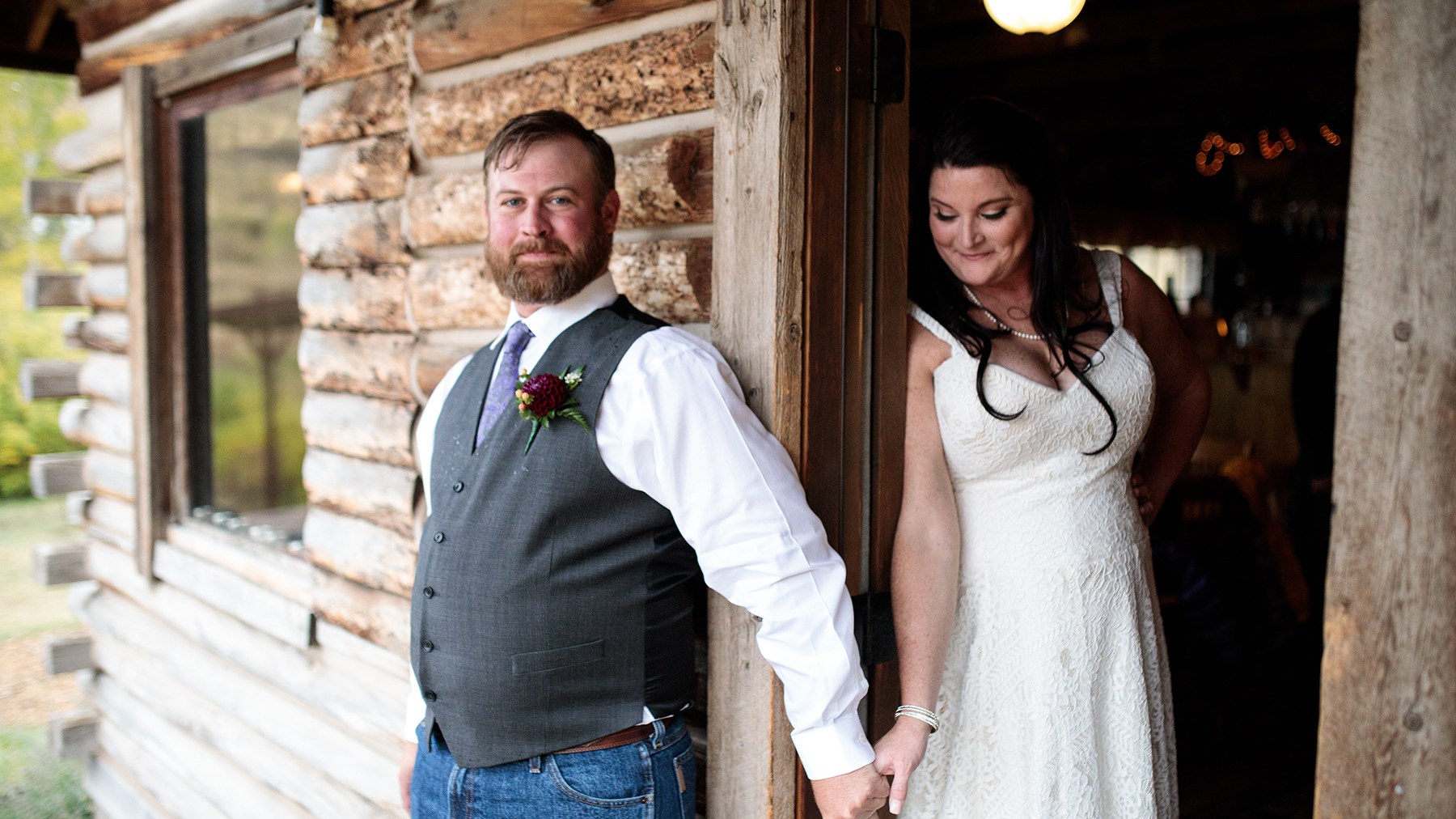 Couple holding hands at Ranch wedding Vail CO