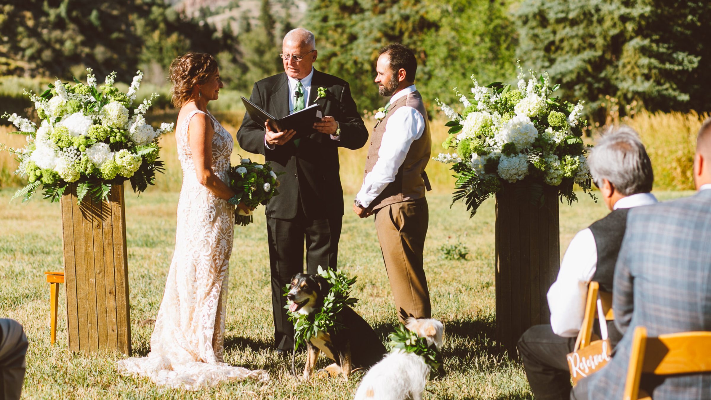 a group of people that are standing in the grass